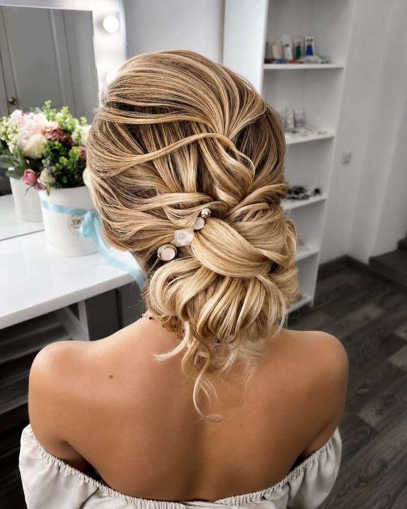 Textured bridal updo with pearl pins, styled by Lili in Whiteley